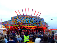 Crowds gather to waatch the opening of Hull fair on the Waltzer Steps