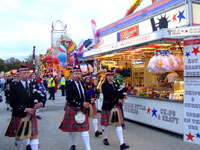Scottish Pipers walk past our dinerat Hull Fair